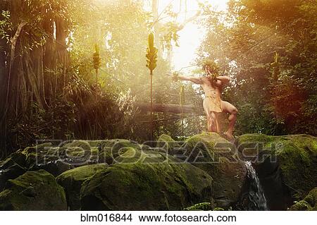 Picture - Hawaiian man dancing in traditional outfit. Fotosearch