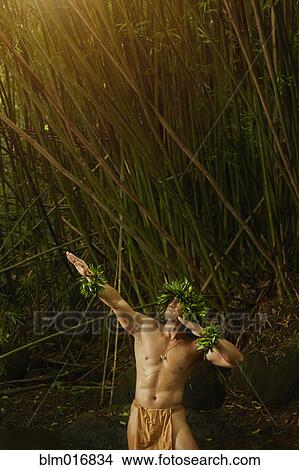 Hawaiian man wearing traditional outfit in jungle View Large Photo Image Picture - Hawaiian man wearing traditional outfit in jungle. Fotosearch