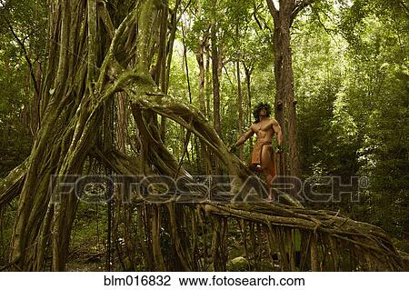 Hawaiian man wearing traditional outfit in jungle View Large Photo Image Stock Image - Hawaiian man wearing traditional outfit in jungle. Fotosearch