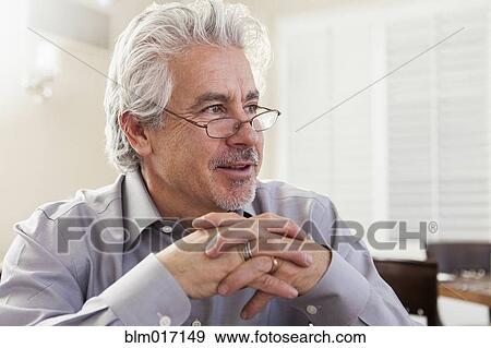 Hispanic businessman sitting in cafe View Large Photo Image Stock Photo - Hispanic businessman sitting in cafe. Fotosearch