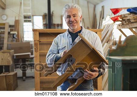 Hispanic craftsman smiling in studio View Large Photo Image Stock Photo - Hispanic craftsman smiling in studio. Fotosearch