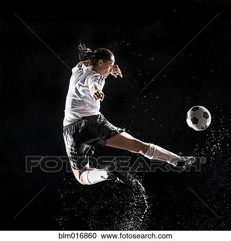 Hispanic soccer player splashing in water View Large Photo Image Stock Image - Hispanic soccer player splashing in water. Fotosearch