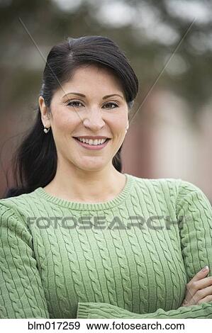 Stock Photo - Hispanic woman smiling. Fotosearch