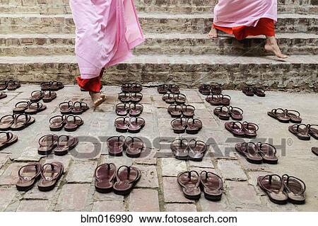 Nuns leaving sandals outside temple steps View Large Photo Image Stock Image - Nuns leaving sandals outside temple steps. Fotosearch