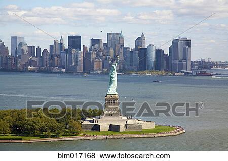 Statue of Liberty and city skyline, New York, New York, United States View Large Photo Image Stock Photo - Statue of Liberty and city skyline, New York, New York, United States. Fotosearch
