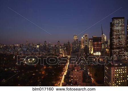 Sunset and illuminated cityscape, New York, New York, United States View Large Photo Image Stock Image - Sunset and illuminated cityscape, New York, New York, United States. Fotosearch