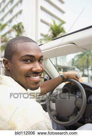 African American man driving convertible View Large Photo Image Stock Photograph - African American man driving convertible. Fotosearch
