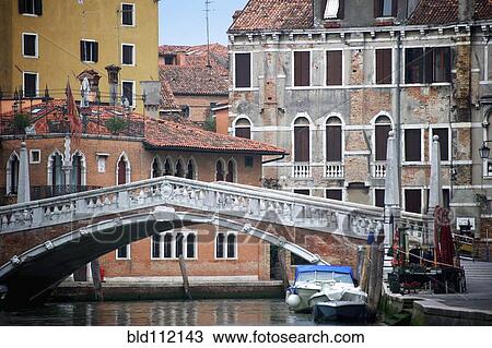 Stock Image - Bridge over canal, Venice, Veneto, Italy. Fotosearch