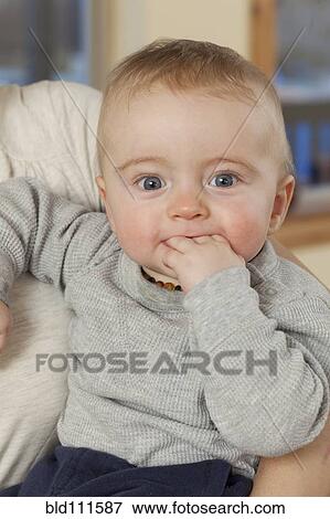 Caucasian baby chewing fingers View Large Photo Image Stock Photo - Caucasian baby chewing fingers. Fotosearch