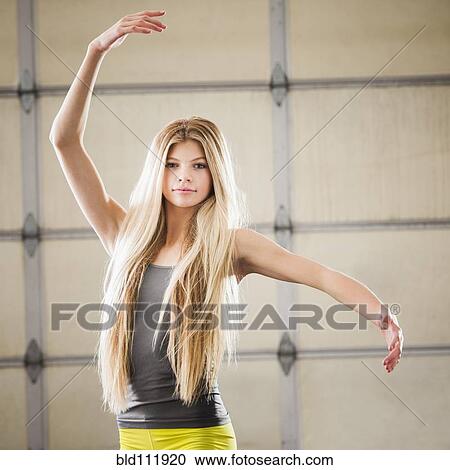 Stock Image - Caucasian dancer practicing in studio. Fotosearch