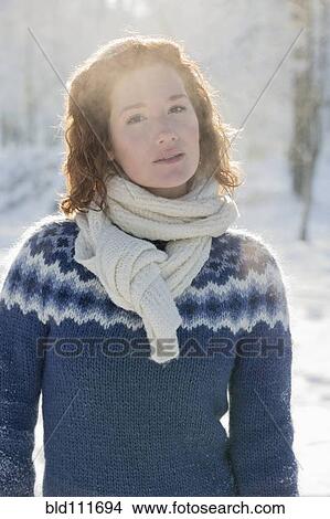 Picture - Caucasian woman standing in snow. Fotosearch