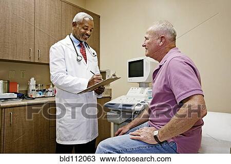 Doctor talking to patient in office View Large Photo Image Stock Image - Doctor talking to patient in office. Fotosearch
