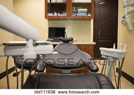 Stock Photo - Empty chair in dentist's office. Fotosearch