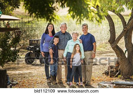 Family smiling in olive grove View Large Photo Image Stock Photo - Family smiling in olive grove. Fotosearch