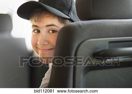 Hispanic boy smiling in car View Large Photo Image Stock Image - Hispanic boy smiling in car. Fotosearch
