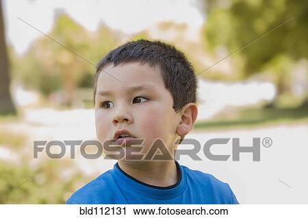 Hispanic boy standing outdoors View Large Photo Image Stock Image - Hispanic boy standing outdoors. Fotosearch