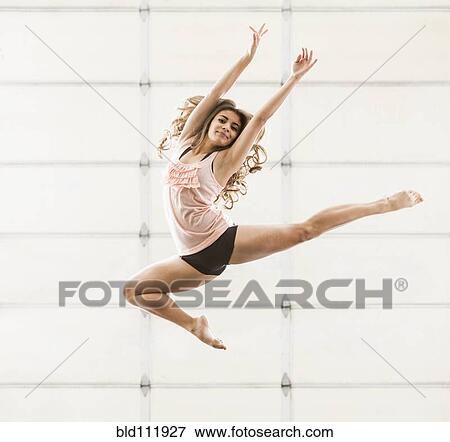 Stock Photo - Hispanic dancer practicing in studio. Fotosearch