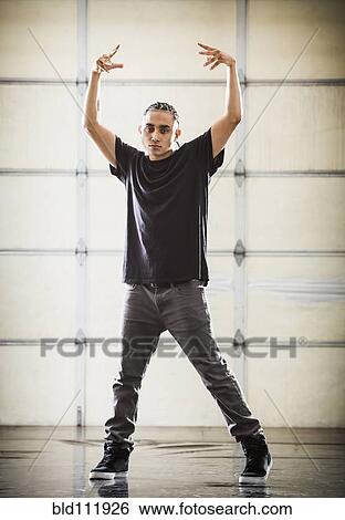 Stock Photograph - Hispanic dancer practicing in studio. Fotosearch