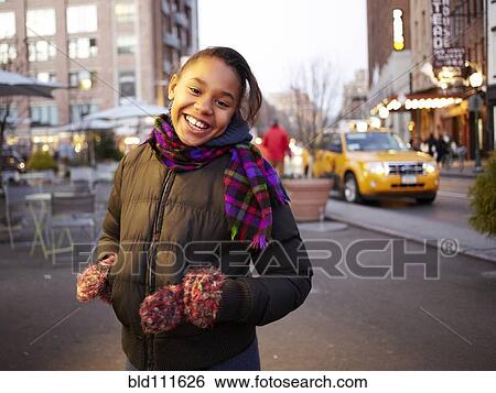 Mixed race girl smiling on city street, New York, New York, United States View Large Photo Image Stock Photograph - Mixed race girl smiling on city street, New York, New York, United States. Fotosearch