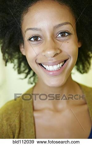 Stock Photo - Mixed race woman smiling. Fotosearch