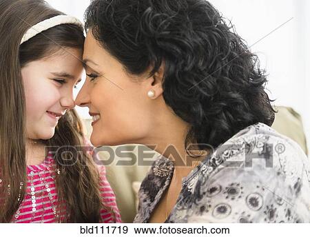 Mother and daughter touching noses View Large Photo Image Stock Photo - Mother and daughter touching noses. Fotosearch