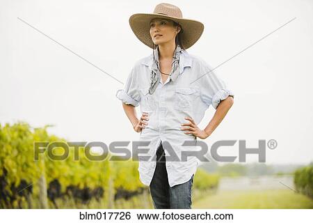 Asian woman walking in vineyard View Large Photo Image Stock Photograph - Asian woman walking in vineyard. Fotosearch