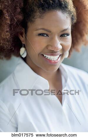 Stock Photography - Black businesswoman smiling. Fotosearch