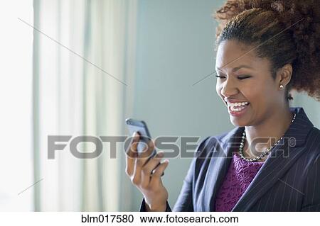 Black businesswoman talking on cell phone View Large Photo Image Stock Image - Black businesswoman talking on cell phone. Fotosearch