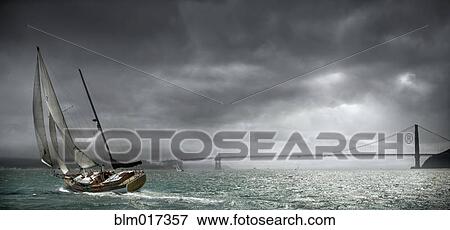 Boat tipping in urban bay, San Francisco, California, United States View Large Photo Image Stock Photo - Boat tipping in urban bay, San Francisco, California, United States. Fotosearch