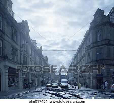 Cars driving on cracked urban pavement View Large Photo Image Stock Image - Cars driving on cracked urban pavement. Fotosearch