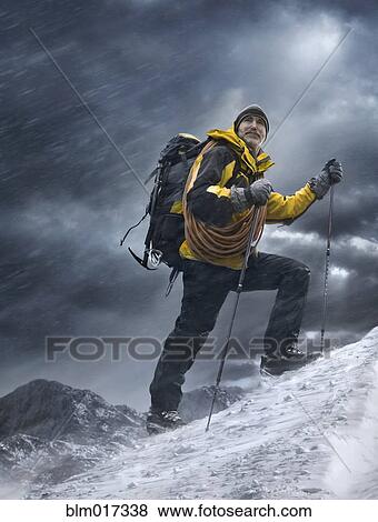 Caucasian man climbing snowy mountain View Large Photo Image Stock Photo - Caucasian man climbing snowy mountain. Fotosearch