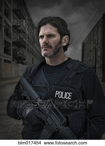 Caucasian policeman on city street View Large Photo Image Picture - Caucasian policeman on city street. Fotosearch