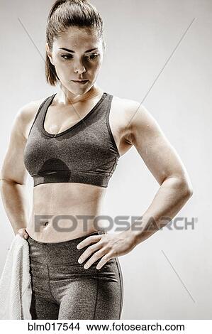 Picture - Caucasian woman resting after workout. Fotosearch