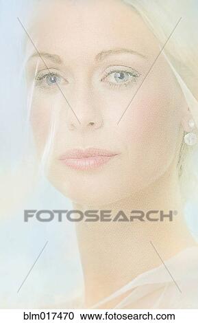 Stock Image - Caucasian woman wearing veil. Fotosearch