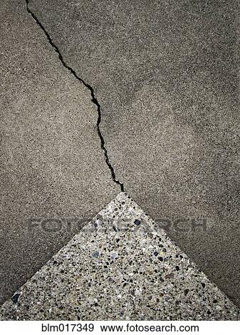Stock Photo - Close up of crack in concrete. Fotosearch