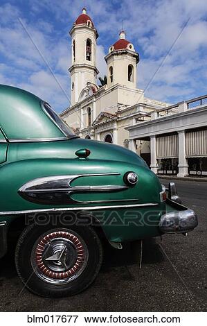 Close up of vintage car on city street View Large Photo Image Stock Photo - Close up of vintage car on city street. Fotosearch