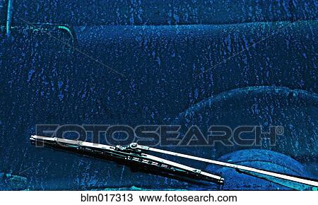 Stock Image - Close up of windshield wiper on car. Fotosearch