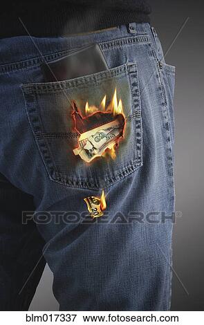 Dollars burning hole in pocket View Large Photo Image Stock Photo - Dollars burning hole in pocket. Fotosearch