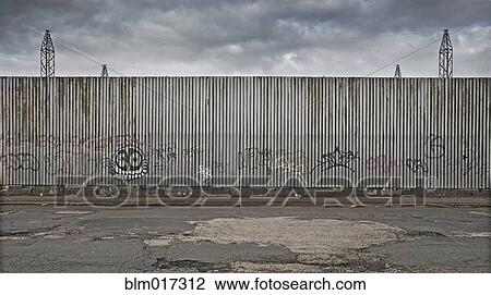 Stock Image - Graffiti on urban metal wall. Fotosearch