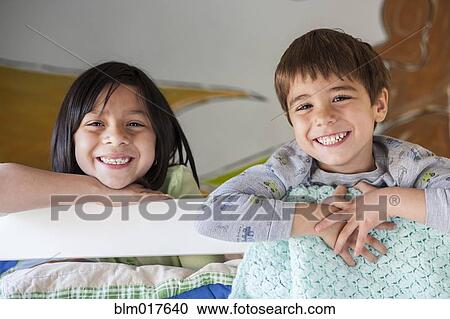 Hispanic children smiling in bunk bed View Large Photo Image Stock Image - Hispanic children smiling in bunk bed. Fotosearch