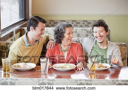 Hispanic family having dinner in restaurant View Large Photo Image Picture - Hispanic family having dinner in restaurant. Fotosearch