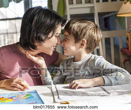 Stock Photography - Hispanic mother and son touching noses. Fotosearch