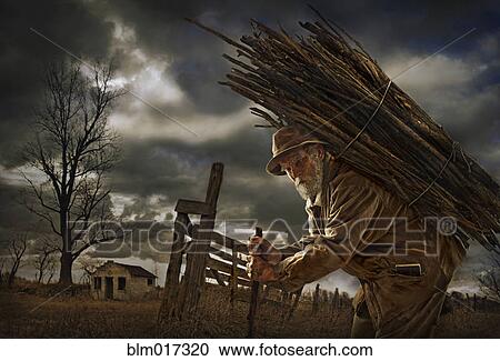 Stock Image - Illustration of Caucasian man carrying wood bundle on back. Fotosearch