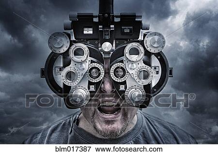 Illustration of man looking through optometrist equipment View Large Photo Image Stock Photo - Illustration of man looking through optometrist equipment. Fotosearch