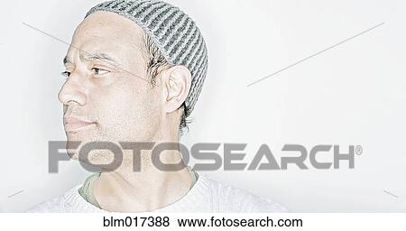 Mixed race man wearing cap View Large Photo Image Stock Photo - Mixed race man wearing cap. Fotosearch