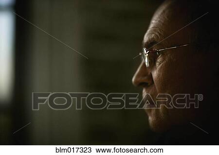 Stock Image - Older Caucasian man's face in profile. Fotosearch