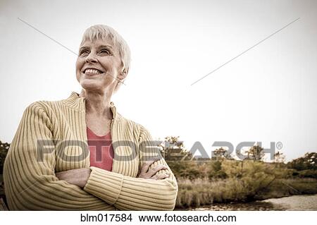 Older Caucasian woman smiling on boat View Large Photo Image Picture - Older Caucasian woman smiling on boat. Fotosearch