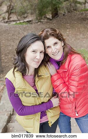 Stock Photo - Older Caucasian women smiling in forest. Fotosearch
