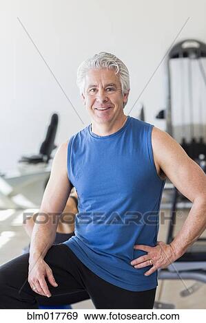 Older Hispanic man smiling in gym View Large Photo Image Stock Photo - Older Hispanic man smiling in gym. Fotosearch