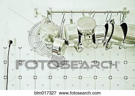 Pots and pans hanging in kitchen View Large Photo Image Stock Photo - Pots and pans hanging in kitchen. Fotosearch